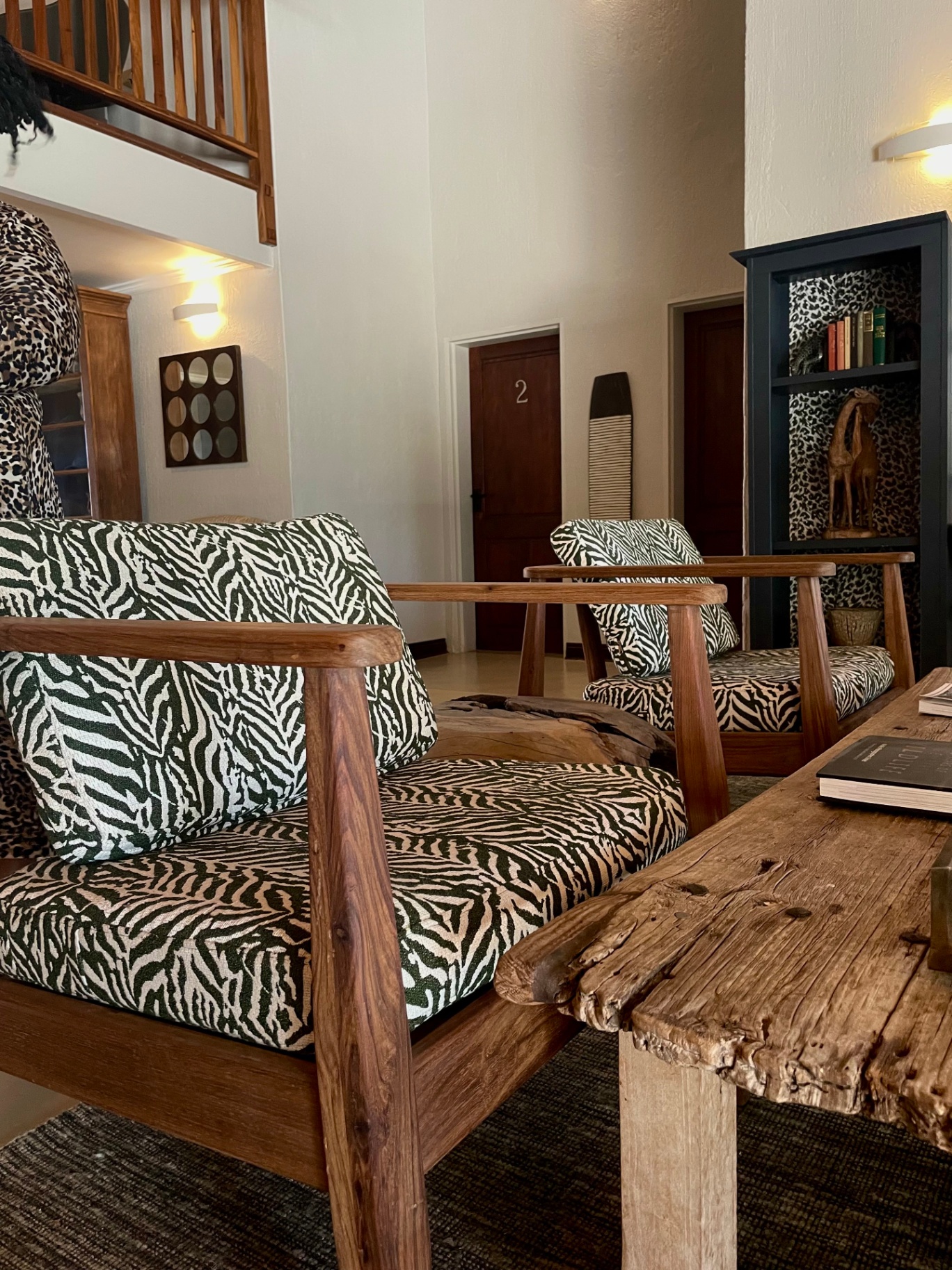 Zebra print reupholstered armchairs