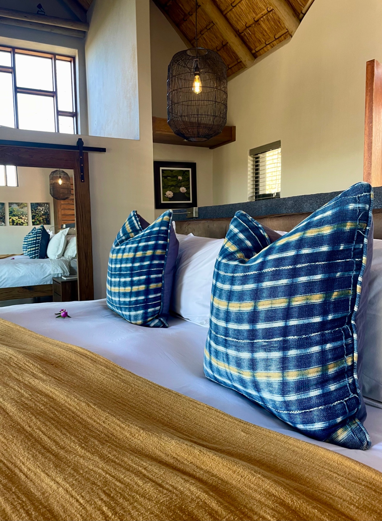 Indigo scatter cushions on king bed