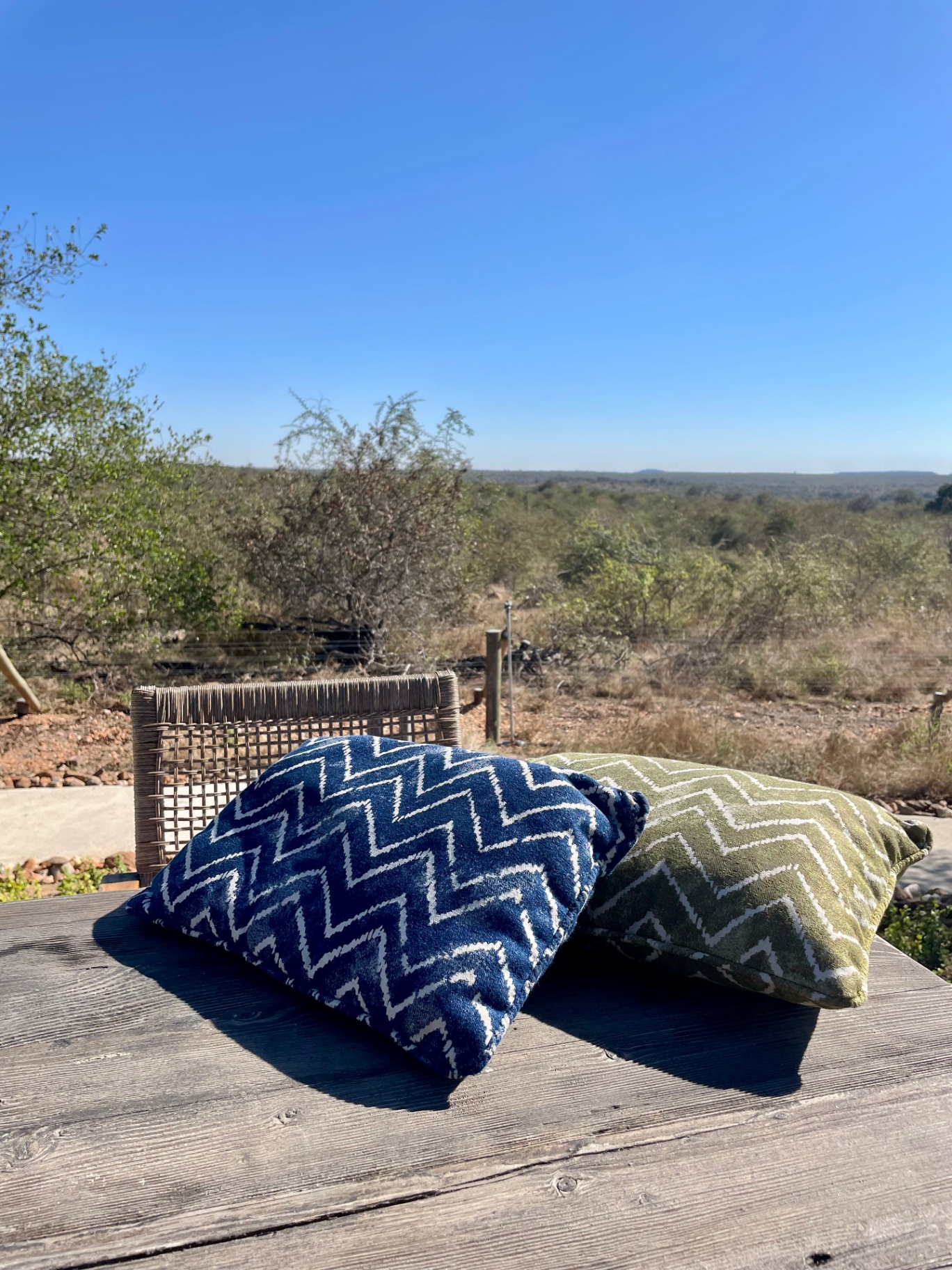Patterned scatter cushions on outdoor bench